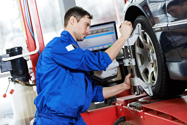 Mechanic working on a car wheel